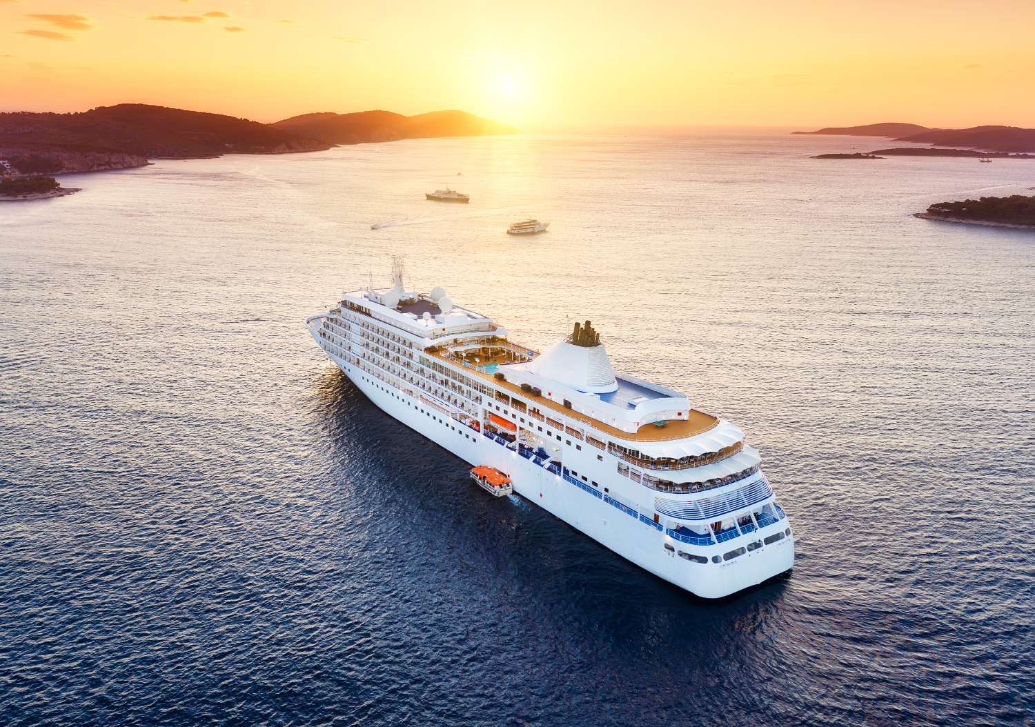 A cruise ship sailing on bright blue open water